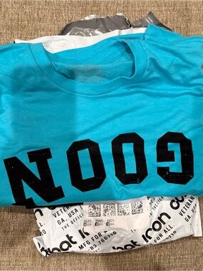 Combat Iron Turquoise Graphic Tee with Bold Blac